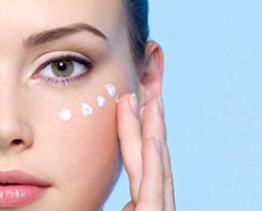 Applying eye cream with gentle dabbing technique under the eye