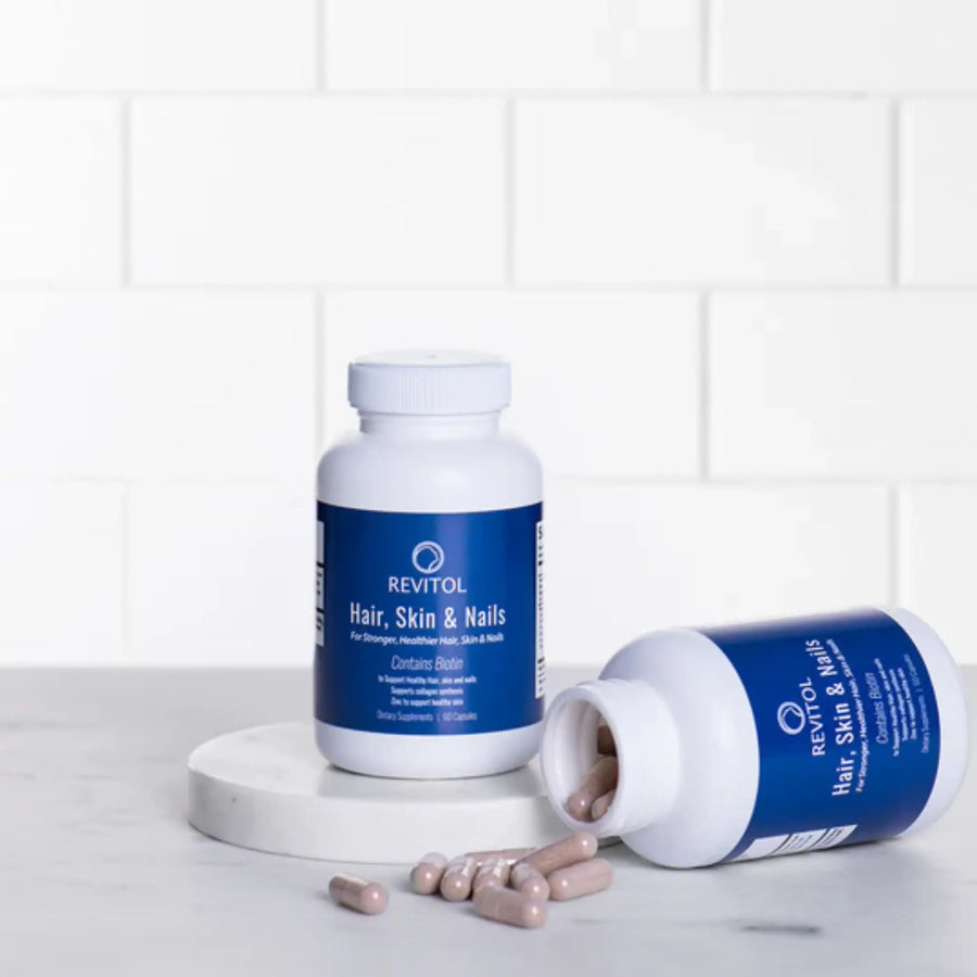 Revitol Hair, Skin & Nails biotin supplement bottles on HealthBuy